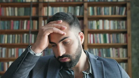 Portrait Of Young Oriental Guy In The Library. Stock Footage 139888522