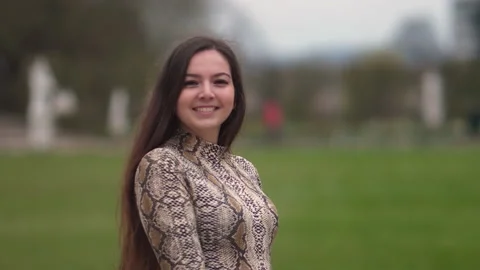Portrait of young pretty long-haired woman turning towards camera 스톡 동영상 170141358