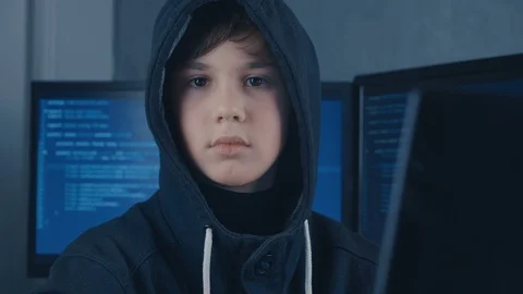 Portrait of a Young Prodigy Boy Hacker Programmer in the data center filled with Vidéo 101738741