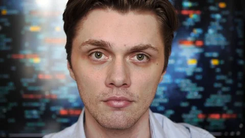Portrait of a young professional man looking into the camera with a screen with Stock-Footage 128439671