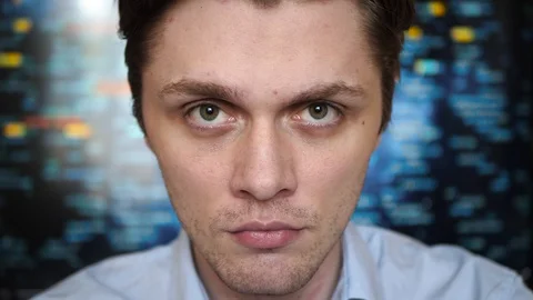Portrait of a young professional man looking intence into the camera with a Stock-Footage 128439724