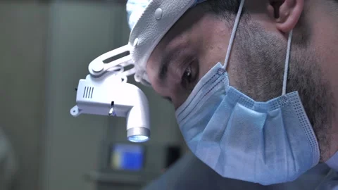 Portrait of young professional surgeon while operation Stock Footage 150550306