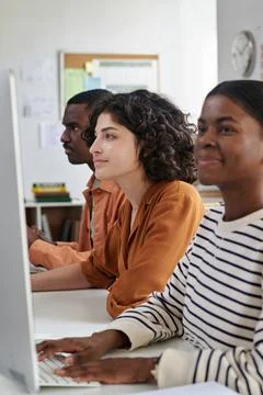 Portrait of Young Professionals Using Computer in Office Setting Stock Photos
