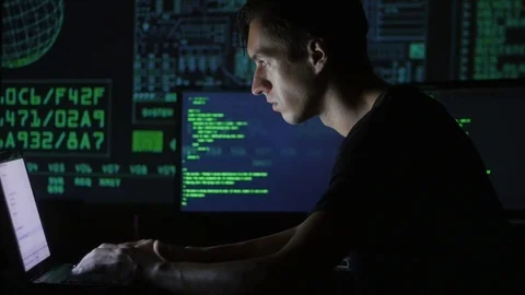 Portrait of a young programmer working at a computer in the data center filled Stock Footage 80267465