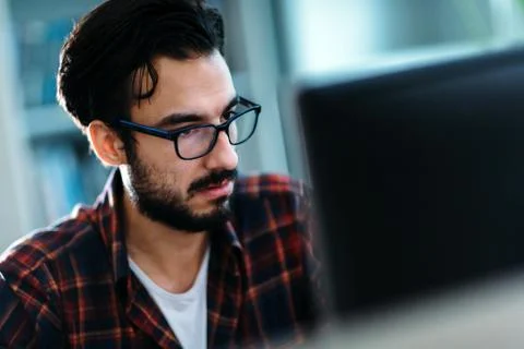Portrait of young programmer working in office Foto stock