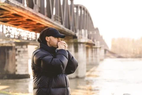 Portrait of young rapper posing under a metal bridge Stock Photos