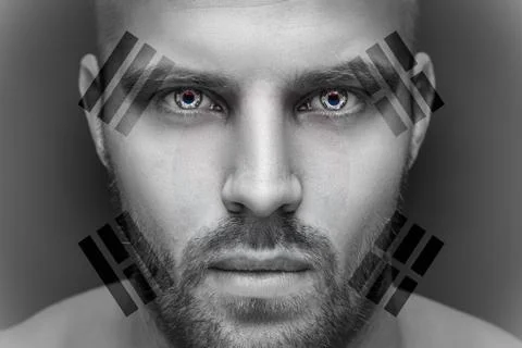 Portrait of a young serious man, in whose eyes the reflected national flag of Stock Photos