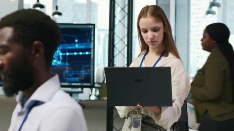 Portrait of young smiling female programmer in office automating with AI Stock Footage 313015489