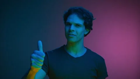 Portrait of Young Smiling Man Looking at Camera and Showing Gesture of Thumbs Up Stock Footage 267060341