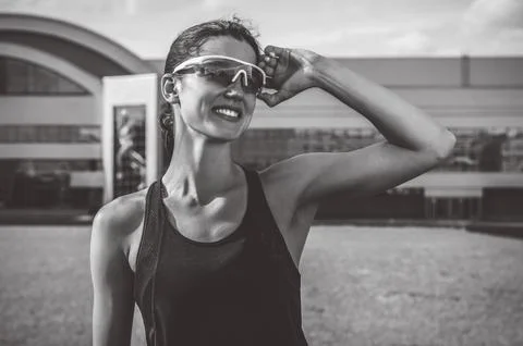 Portrait of a young smiling runner posing at a football stadium. Sports con.. Stock Photos