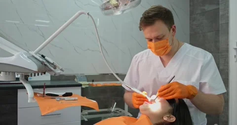 Portrait of young stomatologist while working with patient Stock Footage 197995876