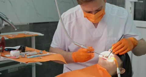 Portrait of young stomatologist while working with patient, Stock Footage 197996372