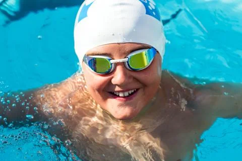 Portrait of young swim student in water. Stock Photos