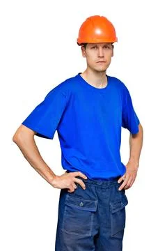 Portrait of a young thin worker in a construction helmet and a blue T-shirt. A Fotos Stock