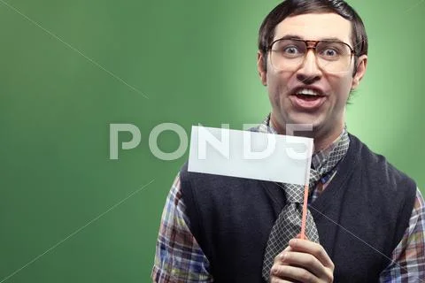 Portrait of young typical nerd isolated on green Stock Photos
