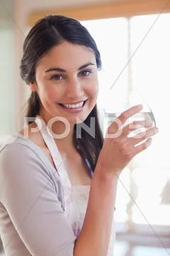 Portrait of a young woman drinking water Stock Photos