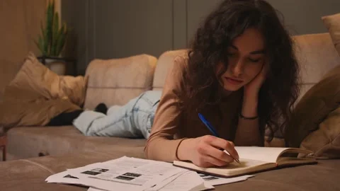 Portrait of Young woman freelancer falling asleep while does distance job at Stock Footage 155736341