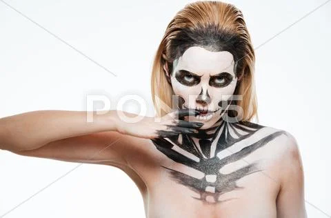 Portrait of young woman with gothic skeleton makeup Stock Photos
