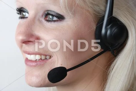 Portrait of young woman with headset Stock Photos