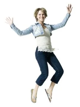 Portrait of a young woman jumping in mid air Stock Photos
