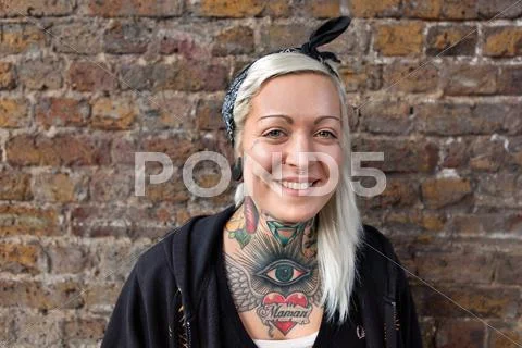 Portrait of young woman with nose ring stud and tattoo Stock Photos
