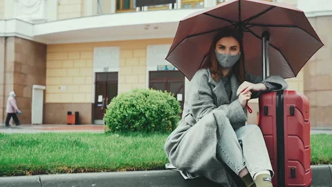 Portrait of a young woman in a protective mask looking at the camera COVID-19 Stock Footage 132256653
