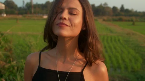 Portrait of a young woman with a retro camera in nature Stock Footage 265979853
