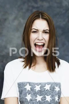 Portrait of young woman shouting Stock Photos