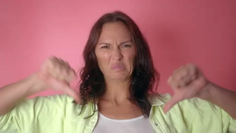 Portrait of Young Woman with Thumbs down Stock Footage 152461153