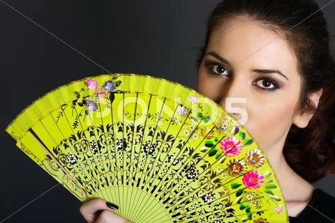 Portrait Of Young Woman With Traditional Fan