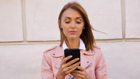 Portrait of young woman using smartpone Stock Footage 104616746