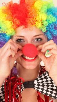 Portrait of young woman wearing clowns costume, close up Stock Photos