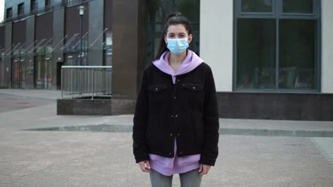 Portrait of a young woman wearing a face mask Stock Footage