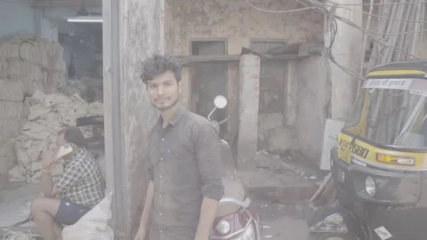 A portrait of a young worker looking at the camera in Mumbai, India Stock Footage 345390372