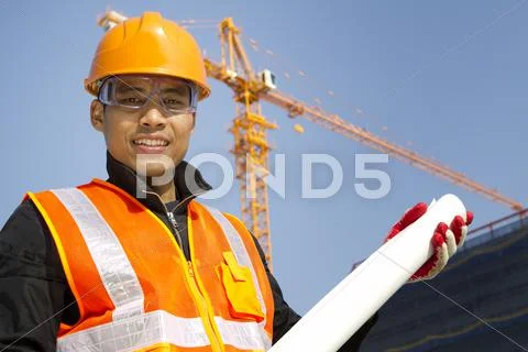 Portraite site manager with safety vest under construction Stock Photos