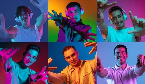 Portraits of young men gesturing isolated on multicolored background in neon Stock Photos