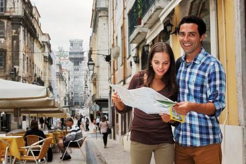 Portugal, Lisboa, Baixa, Rua Santa Justa, young couple with city map in front Stock Photos