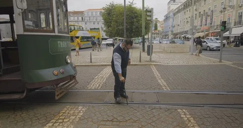 Portugal Lisbon Tram-worker-aligning-track 422 25FPS Stock Footage 128403750