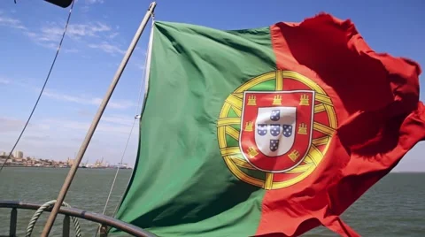 Portuguese flag on a ship on sky background Stock Footage 64579250