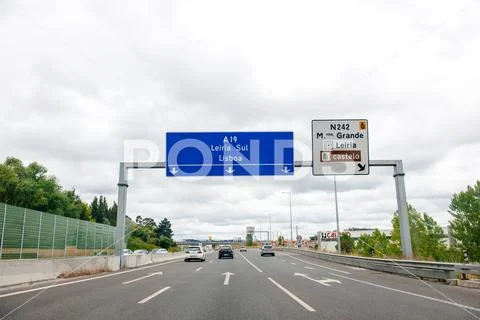 Portuguese highway autobahn with large blue direction sign Stock Photos