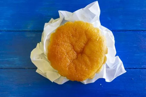 Portuguese typical cake called queijada on blue background Stock Photos