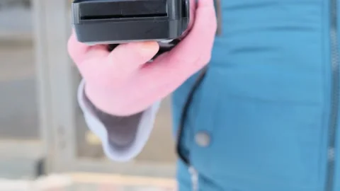 Pos terminal in the hand of a man. Stock Footage 150036836