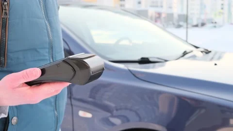 Pos terminal in the hand of a man. Stock Footage 150223193