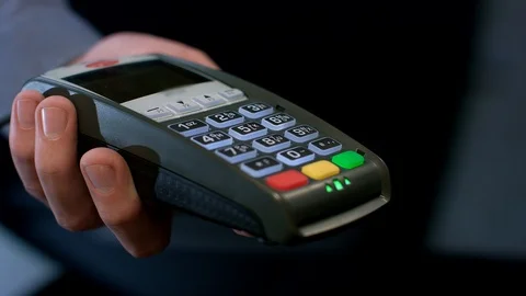 Pos terminal payment. Human hand swipe credit card in payment terminal Stock Footage