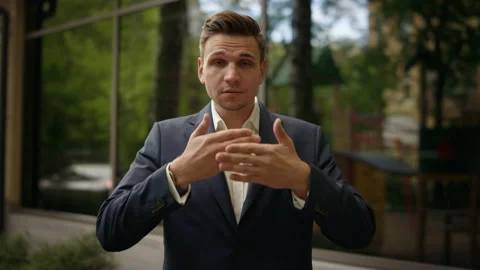 Pose I CAN'T SAY, young businessman closes his mouth by his hands. A highly paid Video stock 134149326
