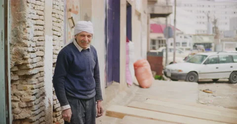 Poses For A Portrait After Doing Woodwork Near The Citadel in Erbil, Iraq Stock Footage 150212994