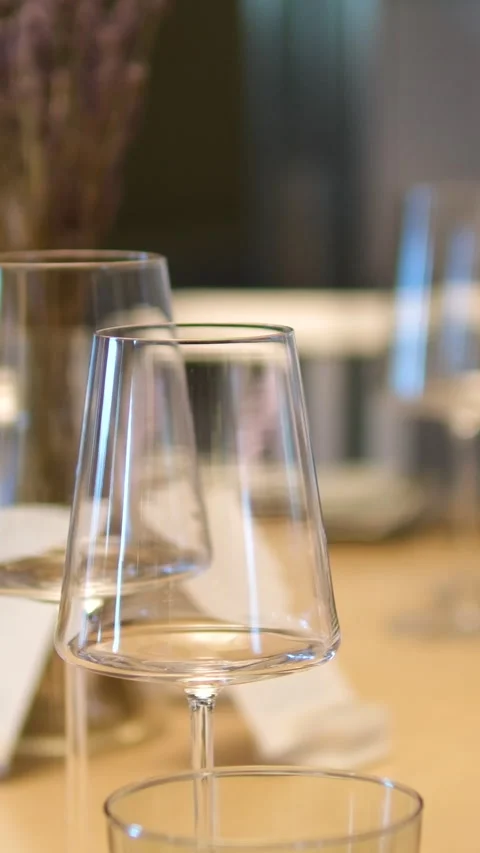 Posh restaurant set table glasses plates. restaurant flashing light work Stock Footage 294625148