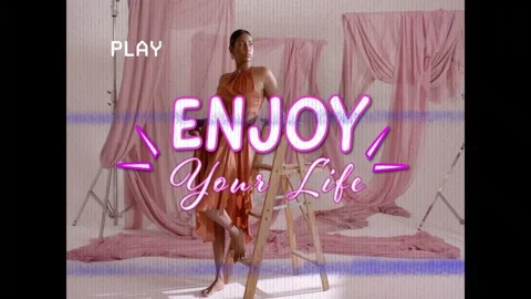 Posing barefoot model orange dress stepping beside wooden ladder on pink set, Stock Footage 332804641