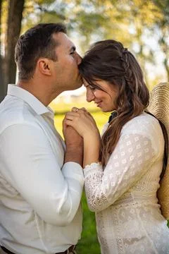 Posing for the camera. Young wedding couple. Romantic Married Couple. The bri Stock Photos