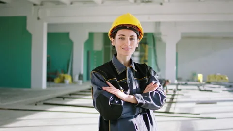 Posing in front of the camera charismatic beautiful woman engineer with a pretty Stock Footage 168629410